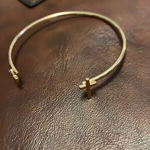 Goldtone open bangle bracelet with two crosses on the ends, new in gift pouch